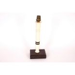 An Art Deco ivory and ebony candlestick table lamp