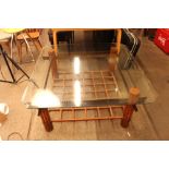 A Multiyork large bamboo and steel based coffee table with b