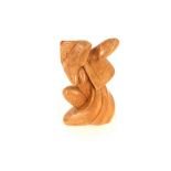 In the style of Henry Moore, a carved wooden sculp