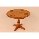 A good quality light elm circular occasional table,