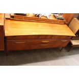 A teak low sideboard fitted drawers and cupboards,