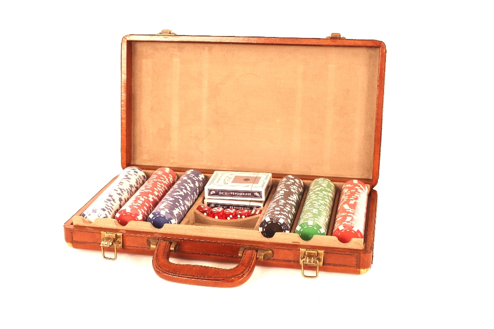 A tan leather cased poker set and contents