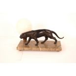 An Art Deco lamp, in the form of a prowling bronze