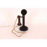 A vintage candlestick telephone, 32cm high