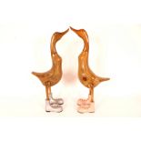 A pair of large wooden duck ornaments, 63cm high