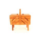 A light wood 1960's / 70's cantilever sewing box