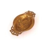 An Art Nouveau design brass fruit dish decorated w