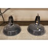 A pair of enamel Industrial hanging ceiling lights