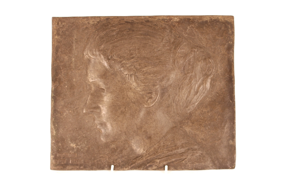 A rectangular lead plaque depicting profile head a