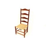 A Cotswold style oak Arts & Crafts chair with stri