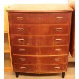 A Danish teak bow fronted chest, fitted six drawer