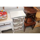 A white painted chest fitted three wicker drawers