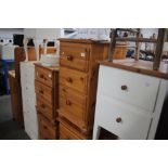 A pair of modern pine bedside chests fitted three