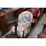 An oak floral upholstered armchair