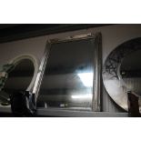 A silvered framed and bevel edged wall mirror