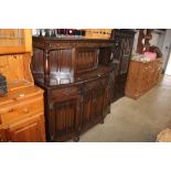 A linen fold decorated court cupboard