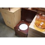 A mahogany commode