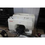 A Janome electric sewing machine with fitted case