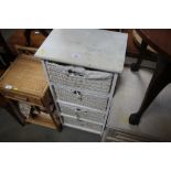 A white painted chest fitted four wicker drawers