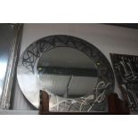 A circular wall mirror