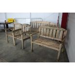 A garden bench; together with one other smaller; a