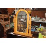 A beech swing framed mirror