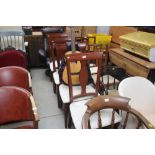 A set of four reproduction dining chairs