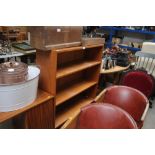 A teak open fronted bookcase