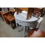 A grey painted demi-lune hall table