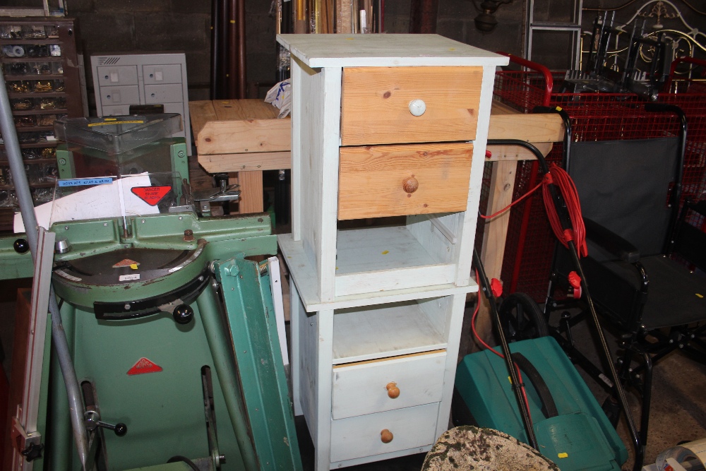 A pair of bedside chests fitted two drawers - each