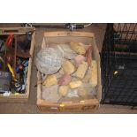 A box containing a buoy; various sand stones etc