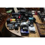 A large quantity of cameras; binoculars etc