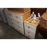 A pine effect three drawer bedside chest; together