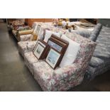 A floral upholstered two seater settee with matchi