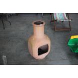 A terracotta chiminea AF