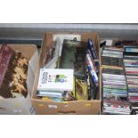 A box of various DVDs etc