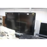 A Samsung flat screen television with remote contr