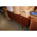 A teak sideboard fitted three drawers
