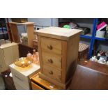 A pine chest fitted three drawers