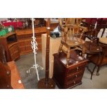 A reproduction mahogany standard lamp; together wi
