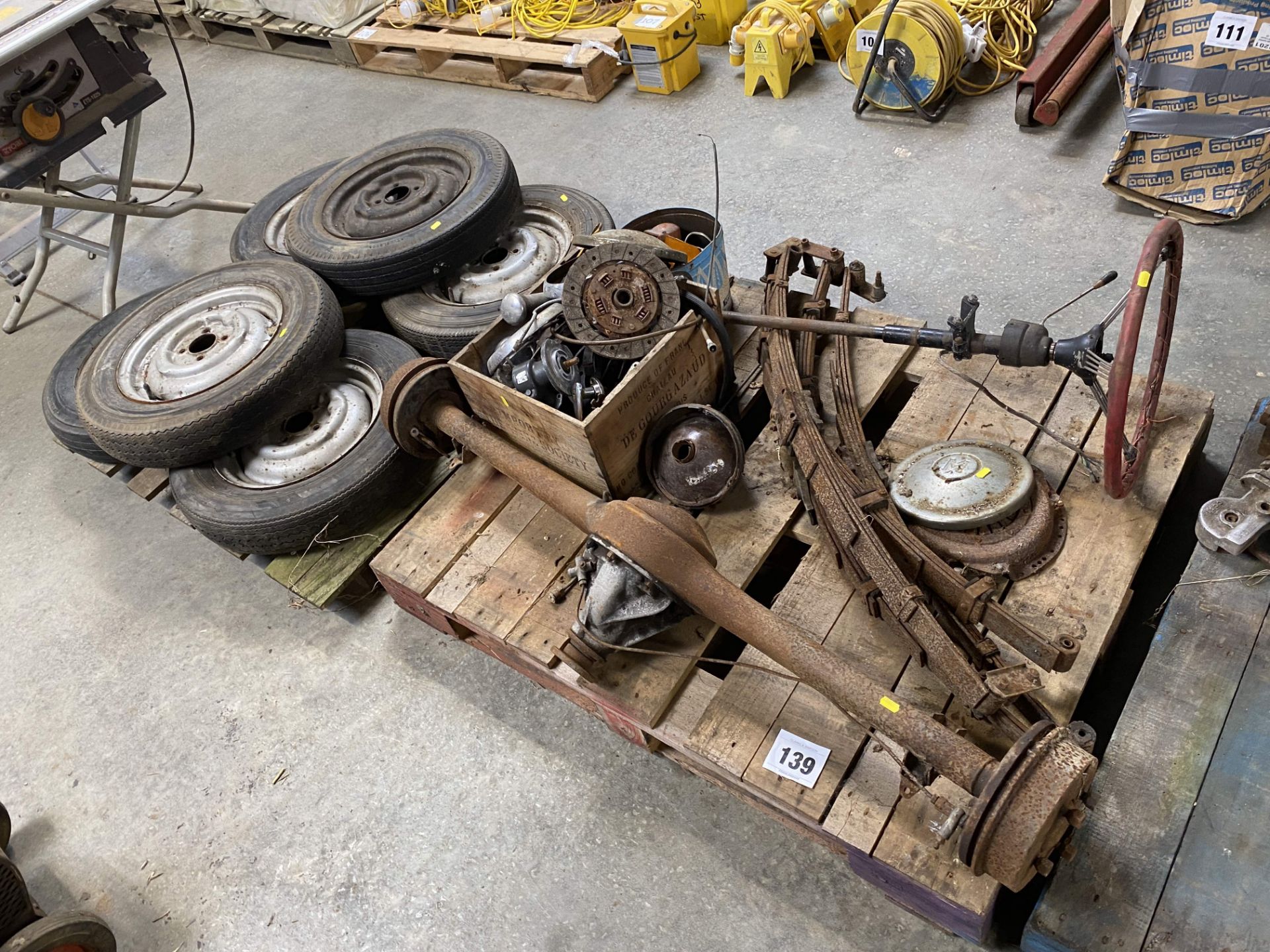 Morris Minor rear axle, clutch, springs, wheels and tyres and various spares.