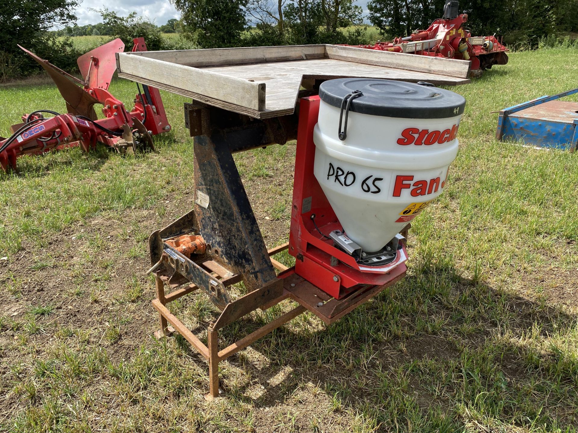 Stocks Fan-Jet Pro 65 slug pellet applicator. Mounted on linkage frame with platform. M