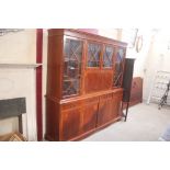 A yew wood wall unit / bookcase