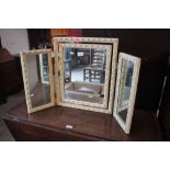 A cream triptych dressing table mirror