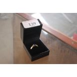 A 14ct gold tanzanite and diamond set ring