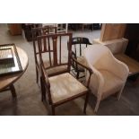 A pair of Edwardian mahogany inlaid elbow chairs;