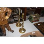 A pair of brass twist candlesticks