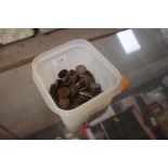 A tub containing various copper coinage