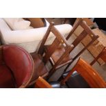 A pair of 1930's oak slat back dining chairs