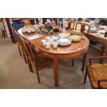 A Chinese hardwood extending dining table